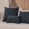 Coussins en lin HECTOR 40x60cm, HORACE 50x50cm, HYPOLITE 25x40cm, coloris NIGHT, thème HANDMADE, tapis BOHEMIAN âme philo en tenture murale, sur canapé en lin coloris CHALK, ligne SLOW, module d'angle COIN et chauffeuse SOLO