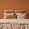 Housse de couette en lin et coton DOLLAR, et taie d'oreiller 65x65cm DONA, coloris SAFARI, coussin en lin 55x110cm CRUSH et 30x60cm COMICS, coloris ALEZAN, thème FARM LIFE, coussin à rayures en lin PAPAYE et PAPYRUS, et boutis PATCHOULI, coloris Pêche, thème LILY OF THE VALLEY