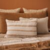 Housse de couette en lin et coton DOLLAR, et taie d'oreiller 65x65cm DONA, coloris SAFARI, coussin en lin 55x110cm CRUSH, plaid COMEBACK, coloris ALEZAN, thème FARM LIFE, coussin à rayures en lin PAPAYE et PAPYRUS, et boutis PATCHOULI, coloris Pêche, thème LILY OF THE VALLEY